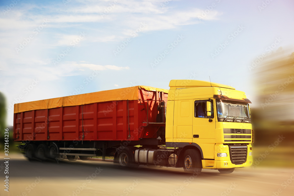 Logistics concept. Truck on country road, motion blur effect Logistics concept. Truck on country road, motion blur effect