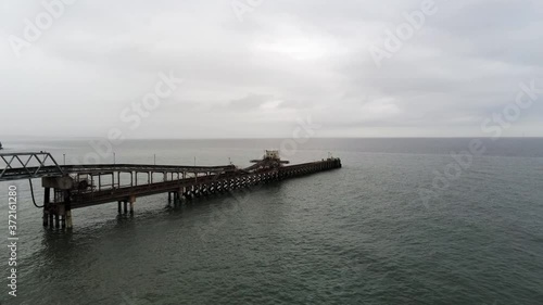 Aerial view Raynes jetty coastal quarry mining marine cargo landmark North Wales wide orbit right photo