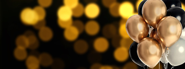 Bright balloons on color background with bokeh effect, space for text. Banner design