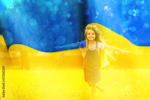 Double exposure of adoracble little girl with flower wreath running outdoors and Ukrainian flag