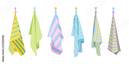 Kitchen textile towels. Cartoon hanging cute towel set of fabric, vector illustration of dry fluffy items for cleaning isolated on white background © ssstocker