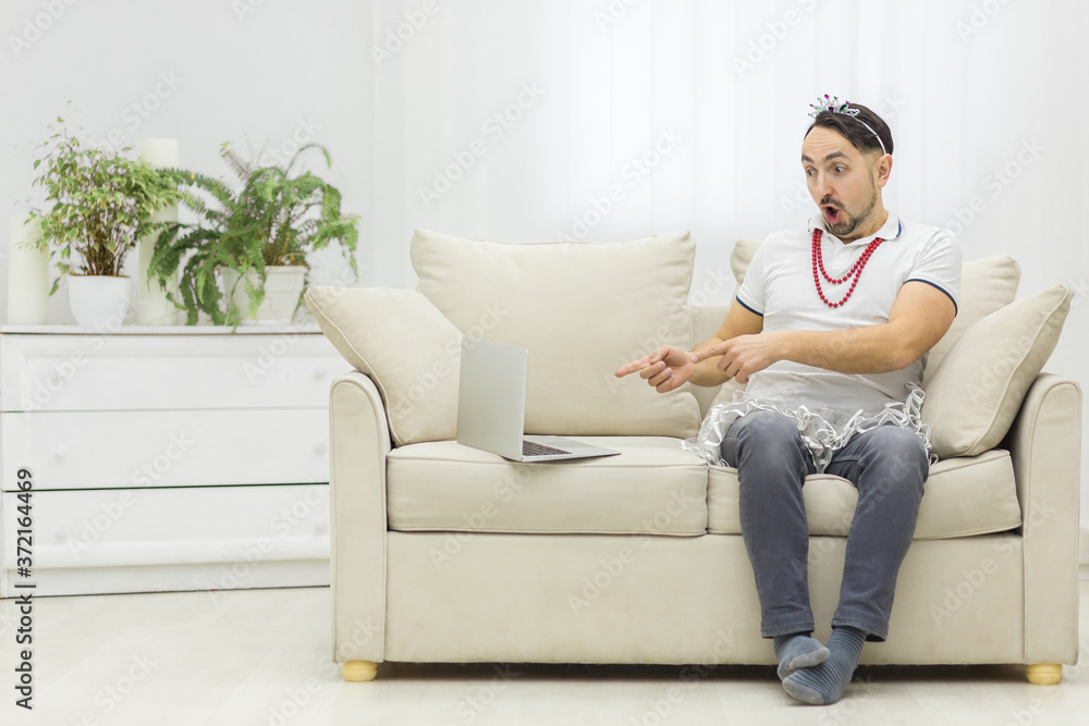 Photo of bearded man excited about something using laptop. Photo of bearded man excited about something using laptop.
