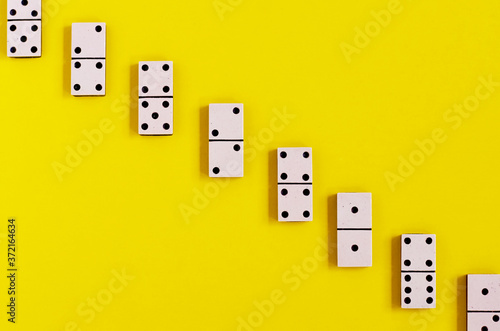 vintage old white Domino on a yellow background