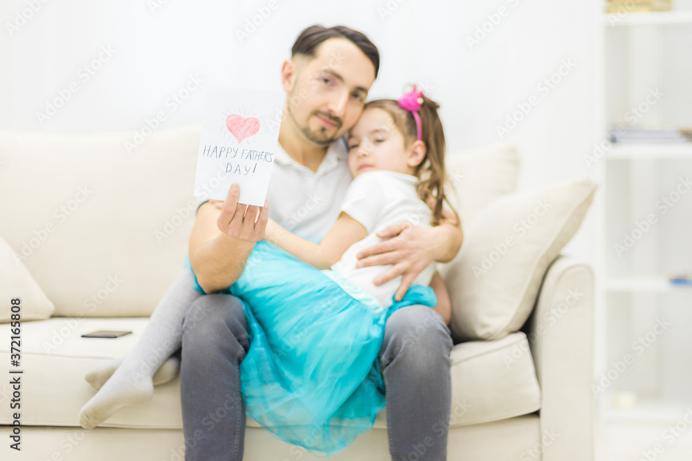 Photo of how daughter wants to greet father with postcard. Photo of how daughter wants to greet father with postcard.