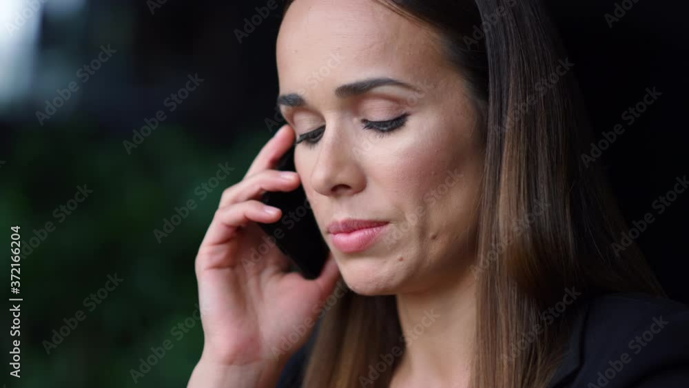 Businesswoman face talking on smartphone. Entrepreneur having phone conversation Businesswoman face talking on smartphone. Entrepreneur having phone conversation