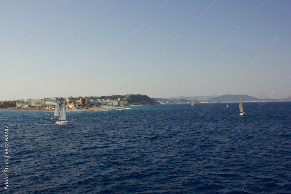 Greece. Rhodes island. Rest at the sea. Euro-trip. Sea water surface. Boats. Greece. Rhodes island. Rest at the sea. Euro-trip. Sea water surface. Boats.