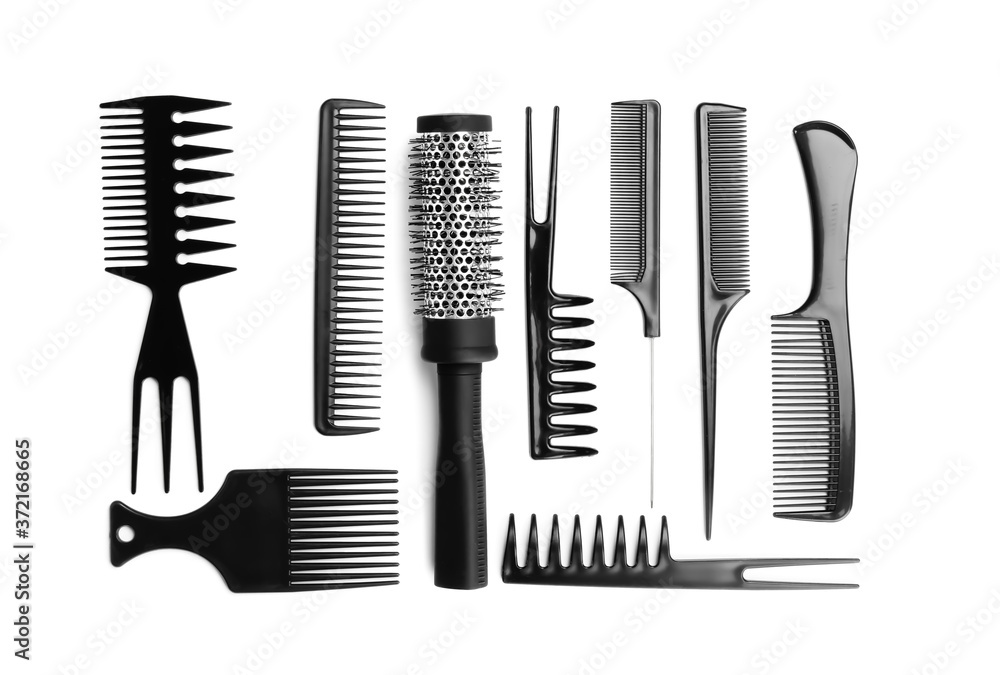 Set of modern hair combs and brush isolated on white, top view Set of modern hair combs and brush isolated on white, top view