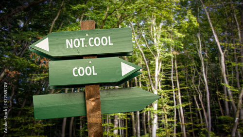 Fototapeta Naklejka Na Ścianę i Meble -  Street Sign to Cool versus Uncool