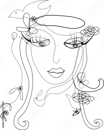 Fantastic face of woman with flowers ,leaves and bird on long hair.