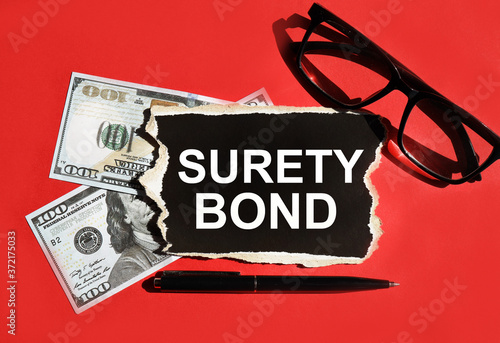 CONTRACT BOND. THE WORD IS WRITTEN ON BLACK PAPER. On a red background