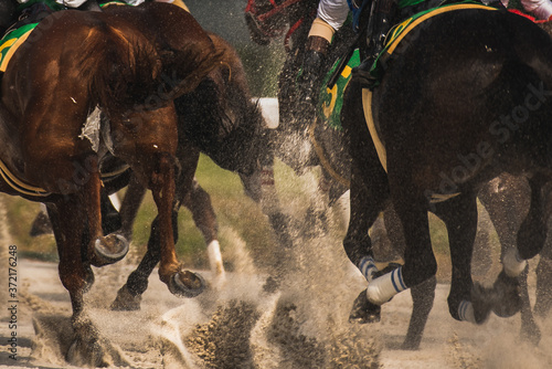 competitive horse racing in heavy sandstorm..
