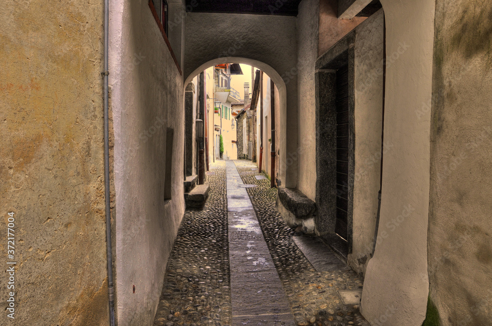 Narrow Alley with Old Rustic Houses in Ronco sopra Ascona in Ticino, Switzerland.