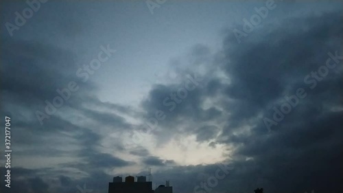 Time lapse video motion of moving clouds with blue sky color.