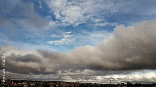 Time lapse video motion of moving clouds with blue sky color.