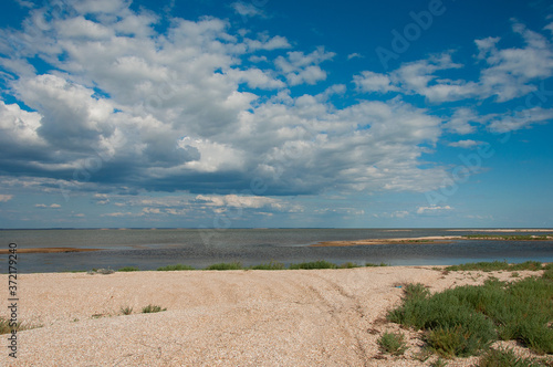 Steppe lake  landscape with clouds