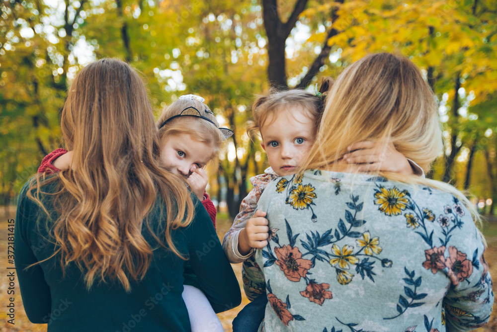 Fototapeta premium mother daughter love hug at autumn city park