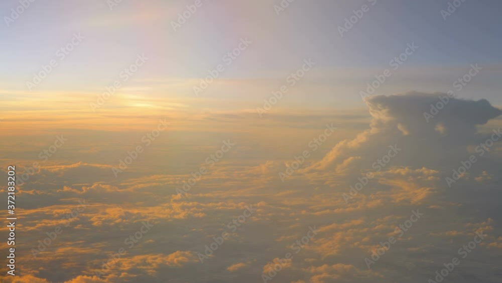 Sunset above the clouds during flight in 4K Sunset above the clouds during flight in 4K