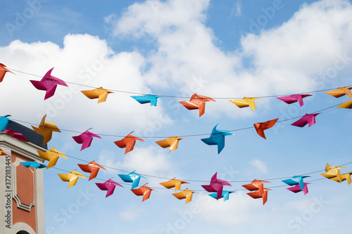 colored paper lanterns set against blue sky