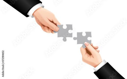 Hands putting puzzle pieces. Teamwork business concept. Teamwork concept. Businessman holds puzzle in hands on background. Cooperation, partnership, working together. Connecting two pieces