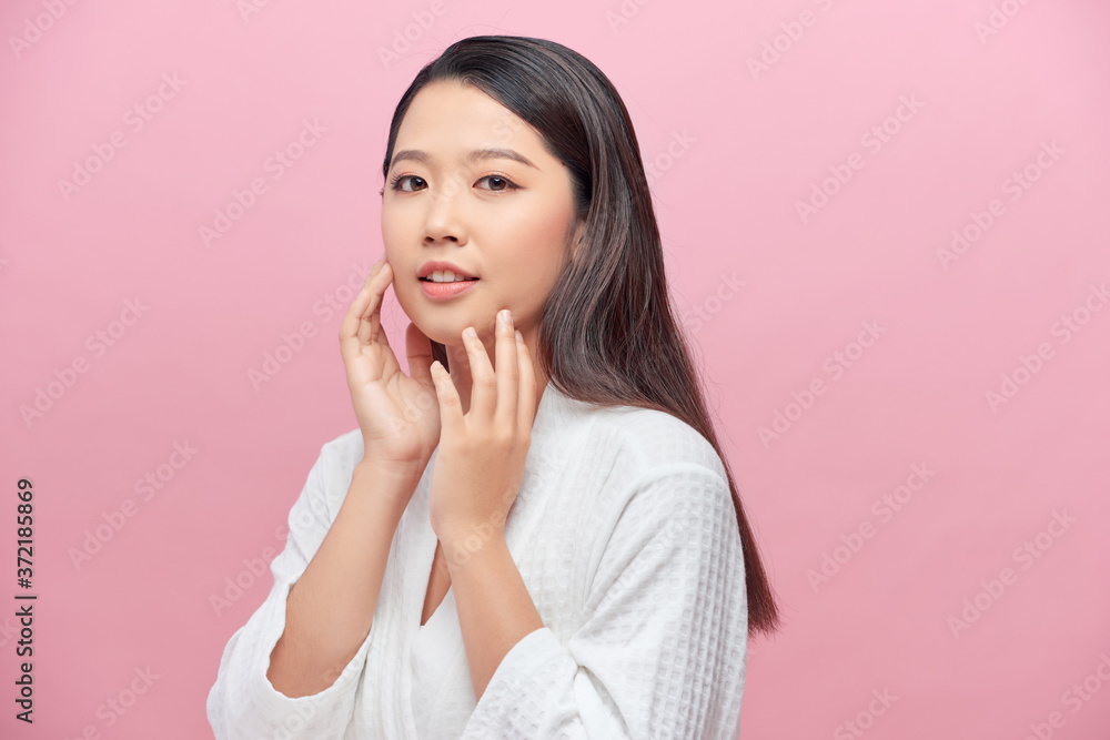 Beautiful Asian young woman touching soft cheek smile with clean and fresh skin Happiness and cheerful with positive emotiona Beautiful Asian young woman touching soft cheek smile with clean and fresh skin Happiness and cheerful with positive emotiona