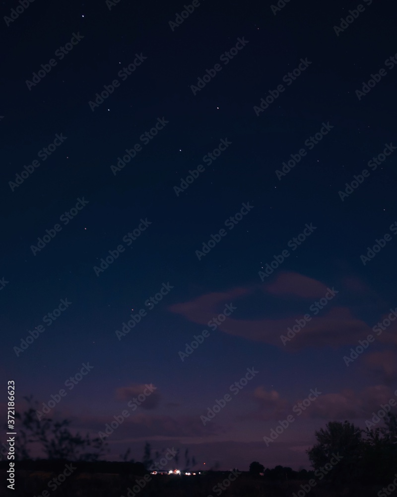Naklejka premium night sky with clouds, night sky at village