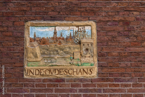 old guild sign on an brick facade in Amsterdam, Netherland