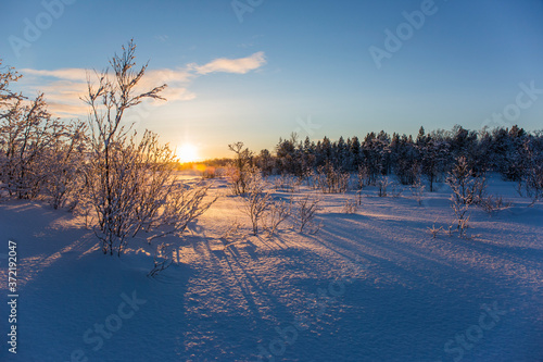 Winter sunset in Nuorgam, Lapland, Finland photo