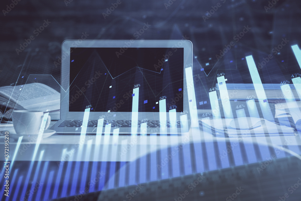 Forex market chart hologram and personal computer background. Double exposure. Concept of investment.