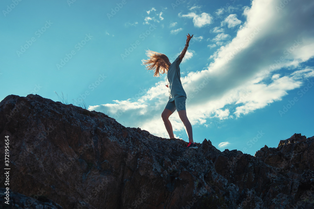 Domestic tourism, travel, lesure and freedom concept after pandemic- woman on the top of Altai mountain, beauty summer evening landcape Domestic tourism, travel, lesure and freedom concept after pandemic- woman on the top of Altai mountain, beauty summer evening landcape