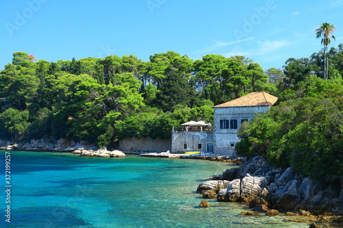 Fototapeta Naklejka Na Ścianę i Meble -  Beautiful old house on Adriatic sea coast, Island Kolocep near Dubrovnik, famous touristic destination in Croatia