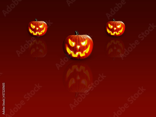 three Halloween Pumpkins on dark red  3d pumpkin faces halloween celebration concept 
