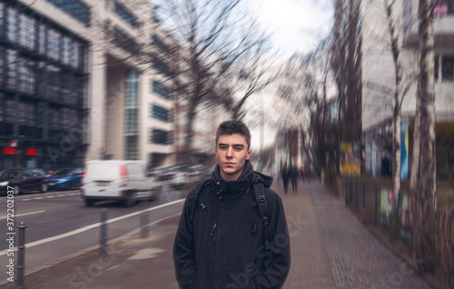 portrait of a serious young man in the streets of Berlin © Armin Staudt