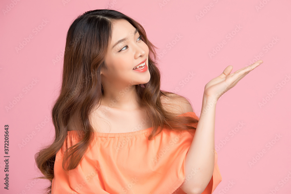 Happy young woman model posing gesture isolated on pink background Happy young woman model posing gesture isolated on pink background