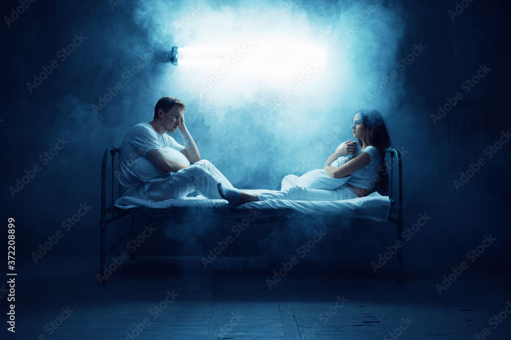 Crazy man and woman sitting in bed, psychedelics Crazy man and woman sitting in bed, psychedelics