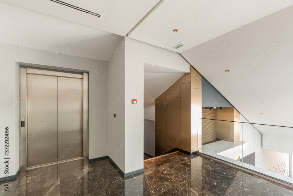 Hotel lobby with elevator door Hotel lobby with elevator door