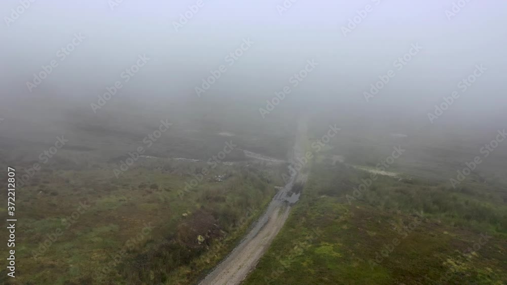 Flying through dense fog at Glengad mountain at Malin in County Donegal - Ireland Flying through dense fog at Glengad mountain at Malin in County Donegal - Ireland