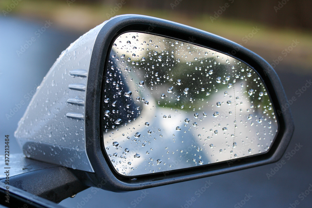 Rain drops on a rear view mirror Rain drops on a rear view mirror