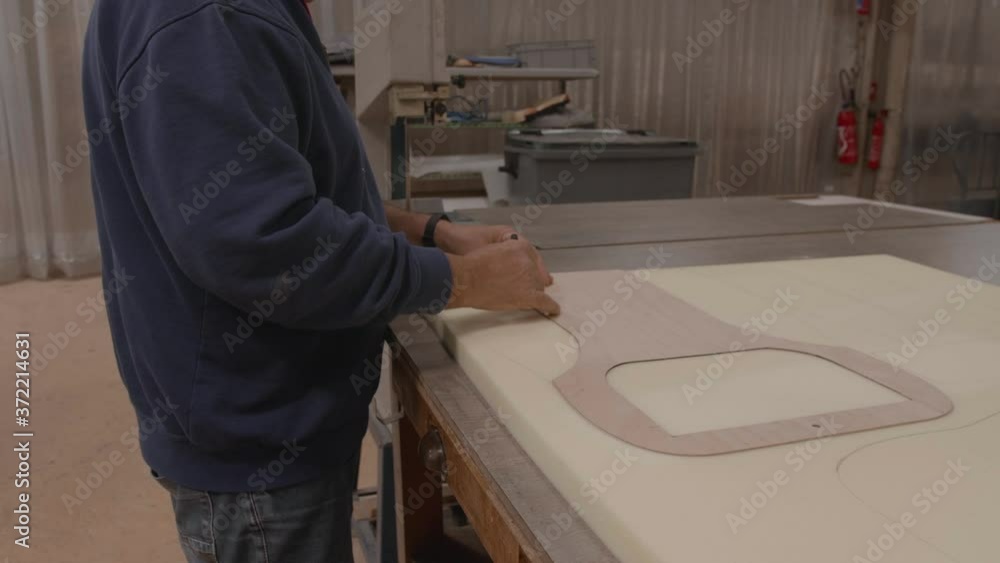 Worker drawing pattern on upholstery foam slowmotion, 4 Worker drawing pattern on upholstery foam slowmotion, 4
