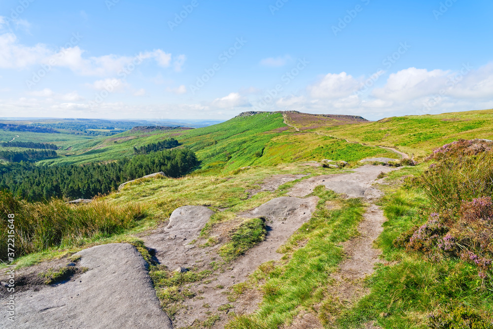 Fototapeta premium Long winding footpath from Burbage Rocks to the top of Higger Tor
