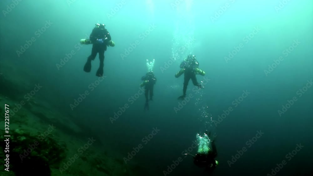 Researcher traveler diver on underwater bottom of Lake Baikal in Siberia Of Russia. Researcher traveler diver on underwater bottom of Lake Baikal in Siberia Of Russia.