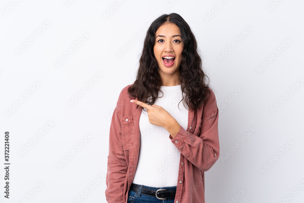 Spanish Chinese woman over isolated white background pointing finger to the side Spanish Chinese woman over isolated white background pointing finger to the side
