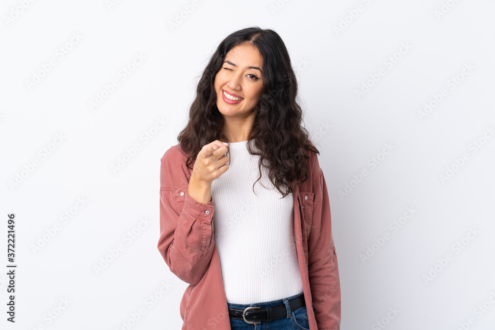 Spanish Chinese woman over isolated white background points finger at you Spanish Chinese woman over isolated white background points finger at you
