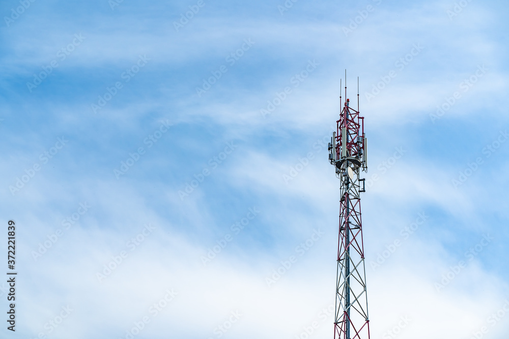 Telecommunication tower of 4G and 5G cellular. Macro Base Station. Wireless Communication Antenna Transmitter. Telecommunication steel high tower with antennas against blue sky. Telecommunication tower of 4G and 5G cellular. Macro Base Station. Wireless Communication Antenna Transmitter. Telecommunication steel high tower with antennas against blue sky.