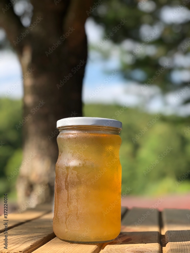 apple cider vinegar in jar on wooden table apple cider vinegar in jar on wooden table