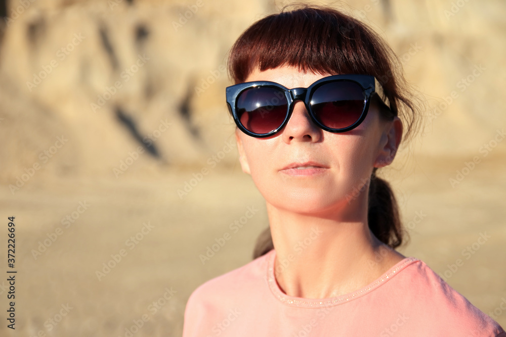 portrait of a woman on the sand portrait of a woman on the sand