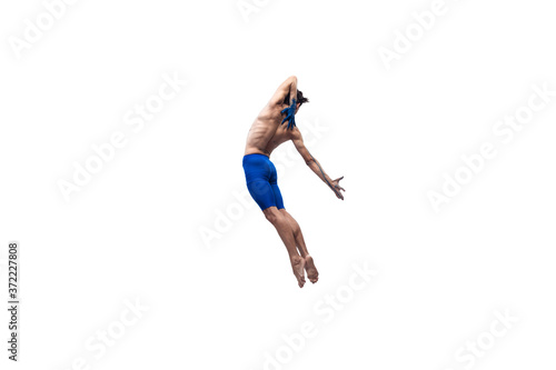 Giving. Male modern ballet dancer, art contemp performance, blue and white combination of emotions. Flexibility, grace in motion, action on white background. Fashion and beauty, artwork concept.