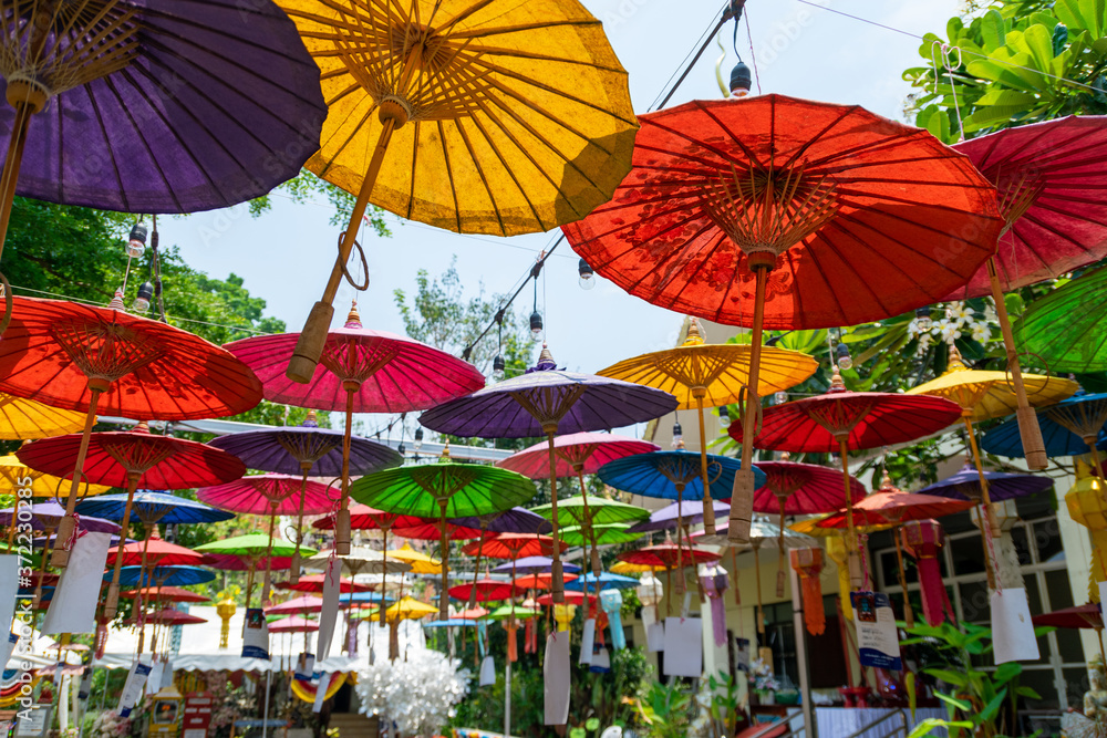 A colorful umbrella hangs in a temple in Chiang Mai.
