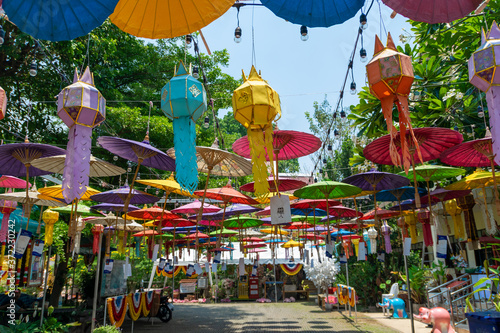 A colorful umbrella hangs in a temple in Chiang Mai. photo