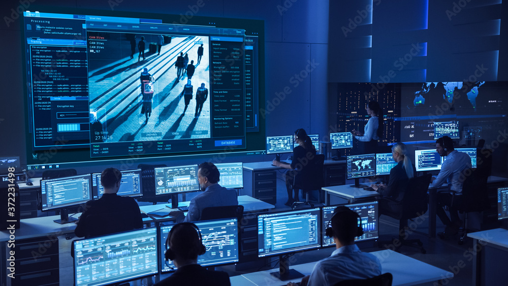 Team of Professional Cyber Security Data Science Engineers Work on Surveillance Tracking Shot of