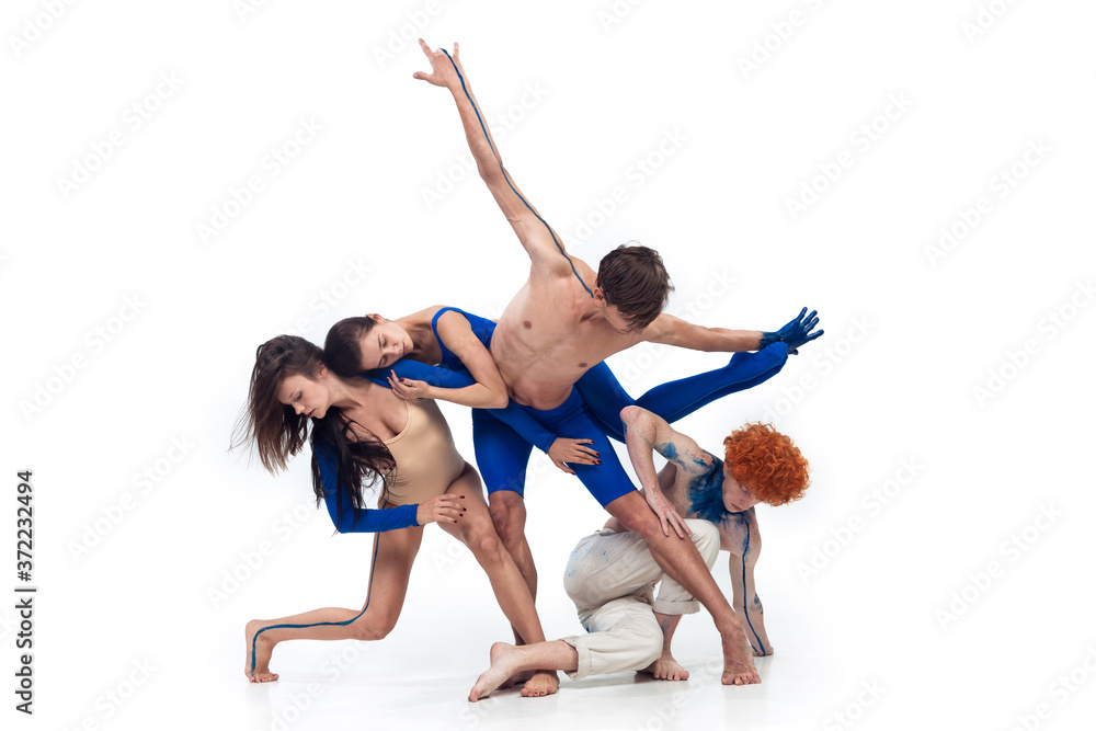 Bird. Group of modern dancers, art contemp dance, blue and white combination of emotions. Flexibility and grace in motion and action on white studio background. Fashion and beauty, artwork concept. Bird. Group of modern dancers, art contemp dance, blue and white combination of emotions. Flexibility and grace in motion and action on white studio background. Fashion and beauty, artwork concept.